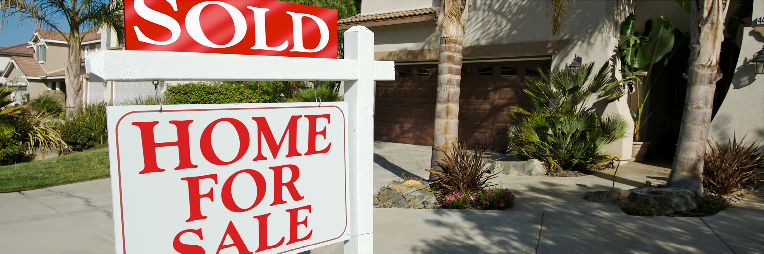 Close-up of House for Sale sign showing as sold